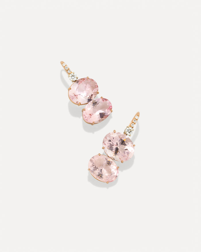 A pair of rose gold drop earrings featuring oval pink gemstones and small diamonds, displayed on a clean light gray background.