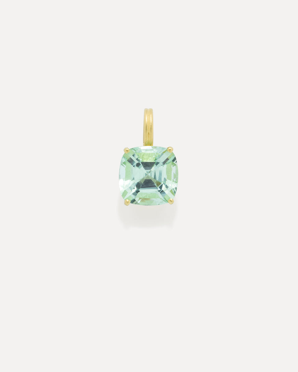 A cushion-cut light green gemstone pendant in a gold four-prong setting with a matching gold bail, centered on a light gray background.